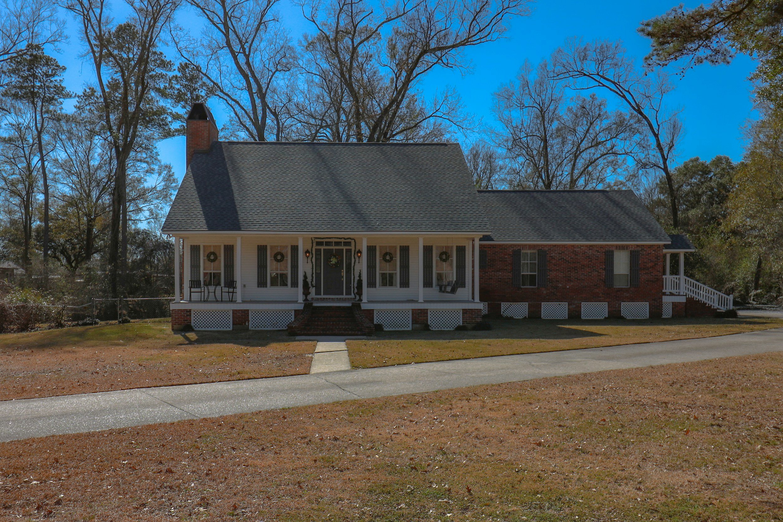Brick ranch house with a front porch