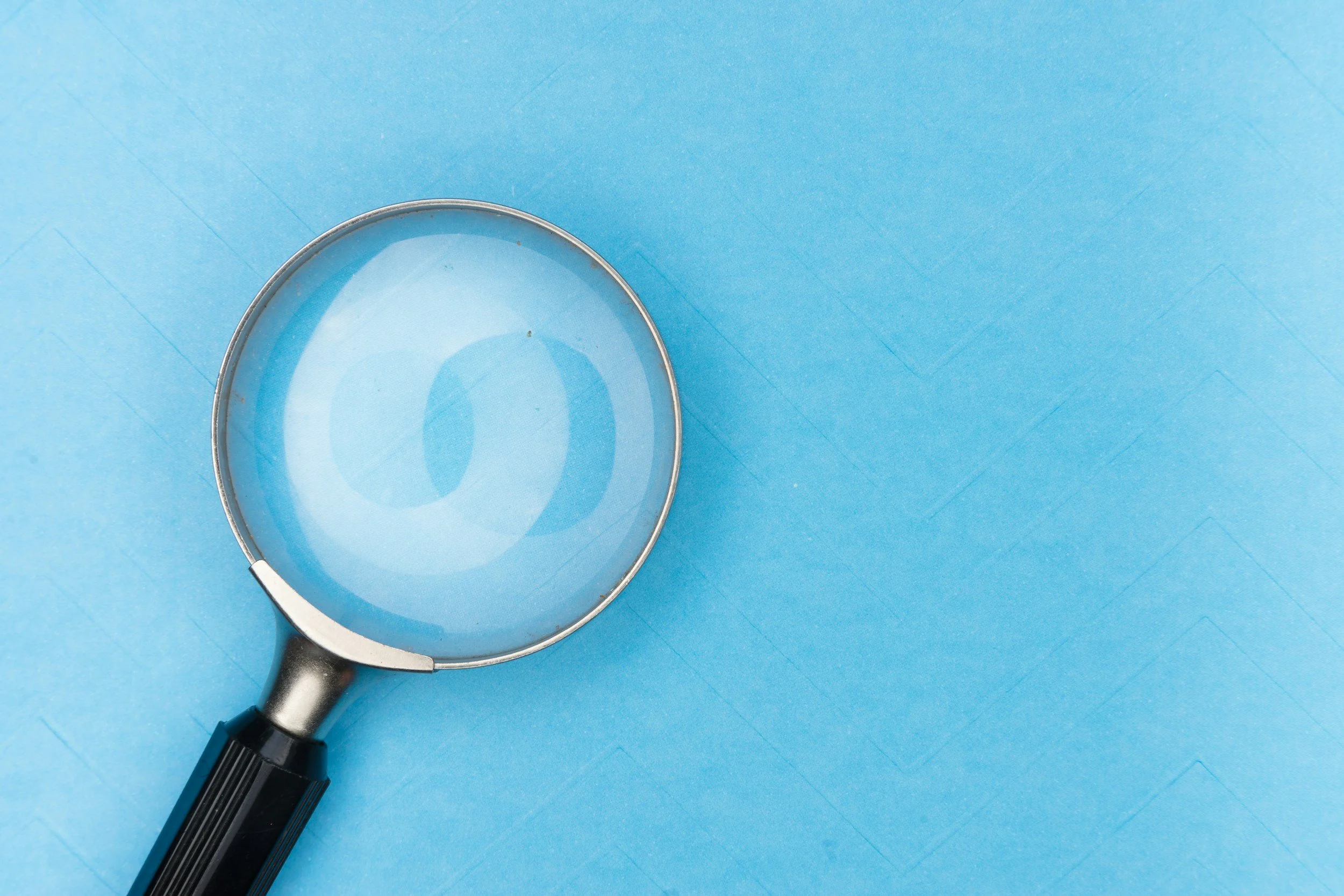Magnifying glass, representing free research into the property records